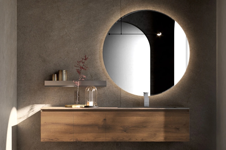  Veliko okruglo ogledalo predstavlja centralni deo minimalističkog kupatila