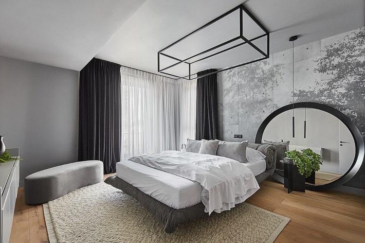 Moderna spavaća soba opremljena u minimalističkom stilu sa velikim bračnim krevetom i sivim zidovima